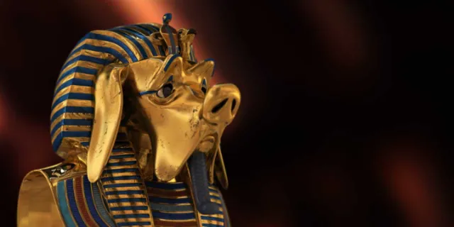 Golden sculpture of Anubis head with pig features by Carsten Mell