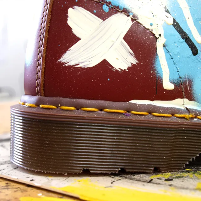 Graphic white cross on shoe