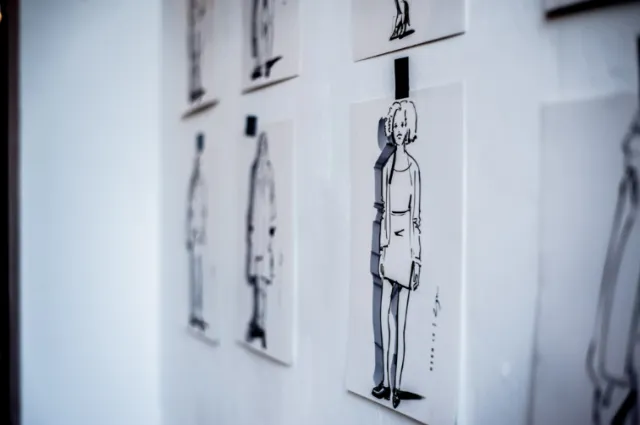 Black and white character sketches pinned on wall by Björn von Schlippe