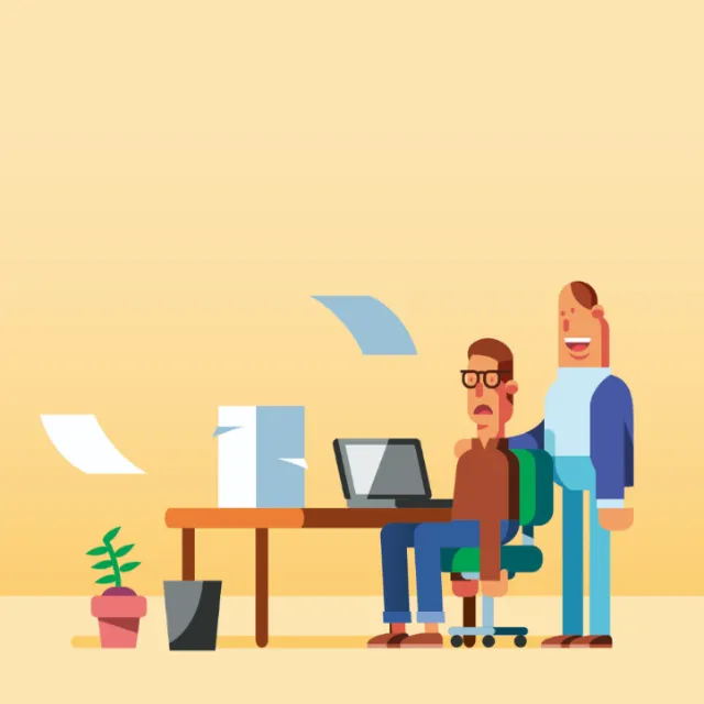 Graphic people at office desk with laptop