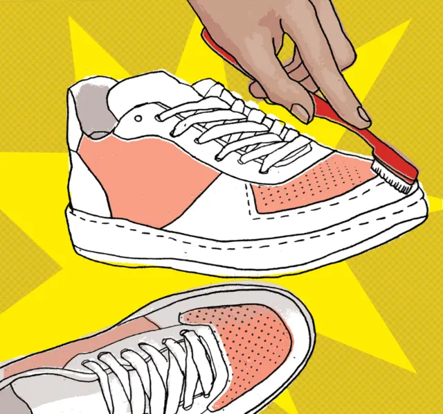 Man cleaning sports shoe