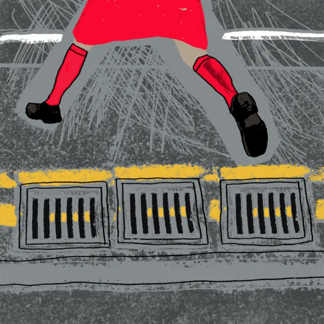 Woman crossing manhole
