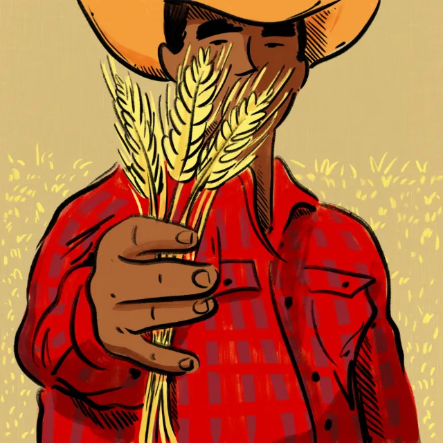 Person holding wheat stalks wearing orange hat and red plaid shirt by Amber Day