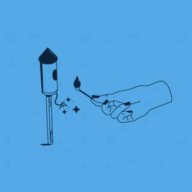 Hand lighting a match near a pen nib by Lukas Bischoff