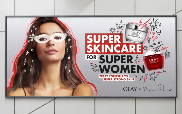 Olay skincare billboard with woman and product jars by Nadia Flower