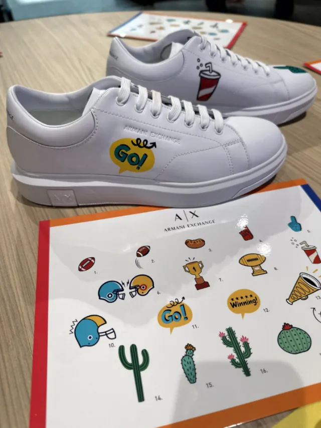 White sneakers with colorful cartoon stickers by Superama