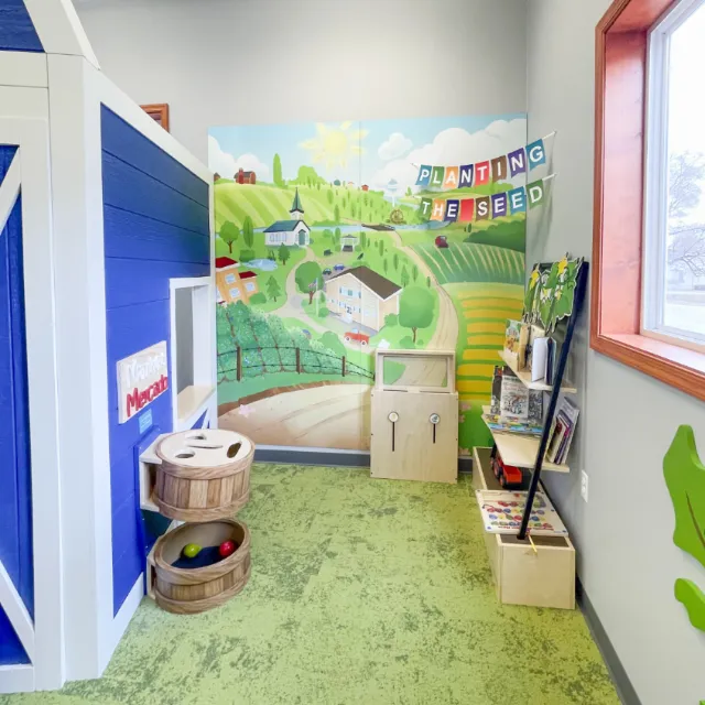 Community mural featuring Ravenna's landmarks and agriculture