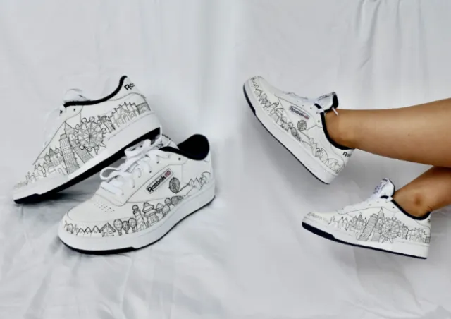 White sneakers with black skyline design by Ellie Compton