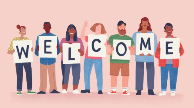 Diverse people holding welcome signs by Drew Bardana
