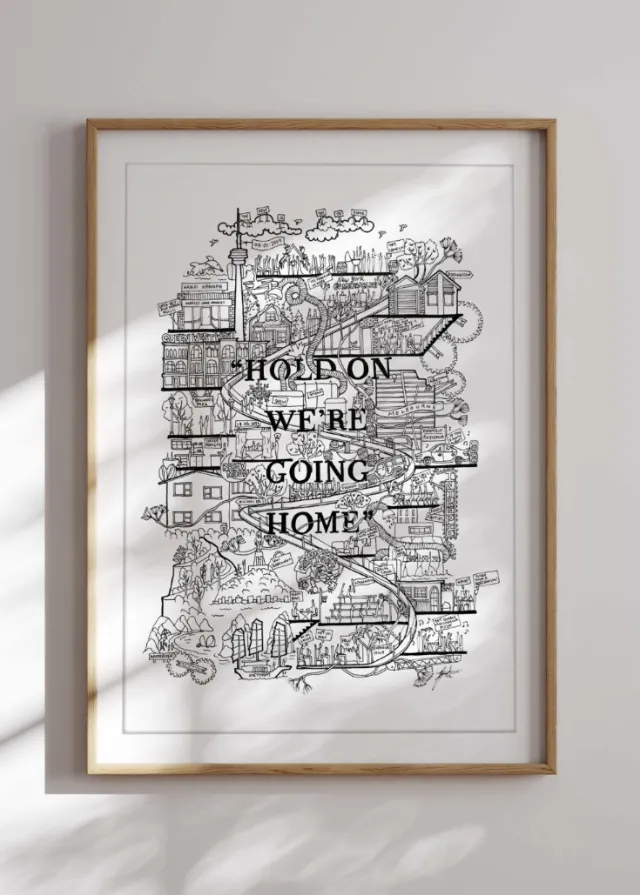 Framed black and white city map art with text 'Hold on we're going home'.