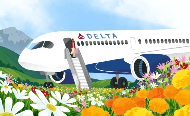 Delta airplane landing in a colorful South American wildflower field
