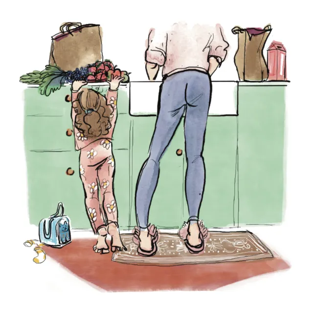 Child and adult washing dishes together at kitchen sink