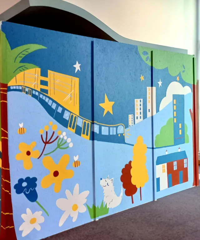 Brightly colored mural designed to engage visitors in a busy public space