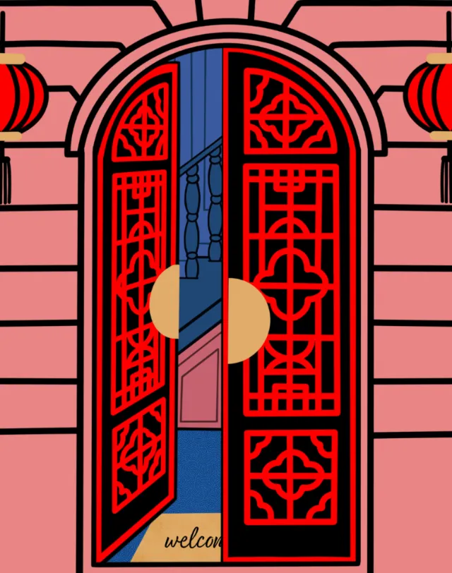 Red Chinese double door with geometric patterns and lanterns on pink wall