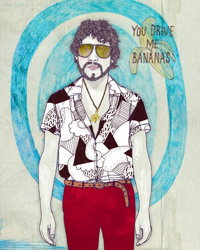 Man with curly hair, sunglasses, patterned shirt, and red pants with text 'You drive me bananas'