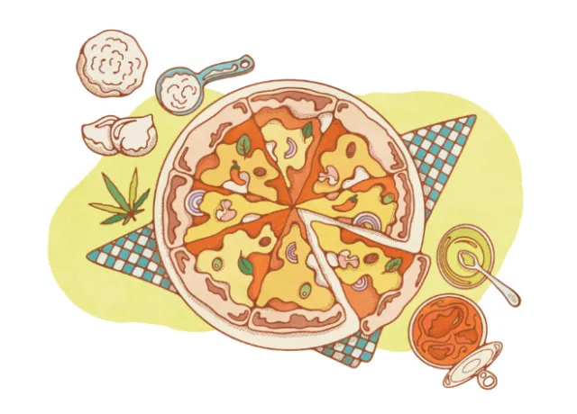 Sliced pizza on checkered napkin with condiments around