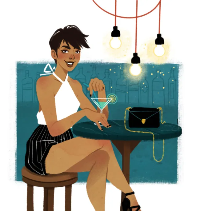 Stylish woman sitting at bar holding cocktail by Manu Cunhas