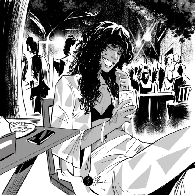 Woman with long hair smiling and holding a cup at outdoor cafe