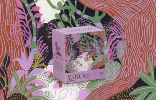 Pink packaging box with floral jungle design on colorful background
