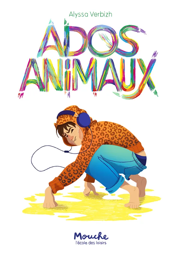 Child in leopard print hoodie with headphones crouching on yellow ground