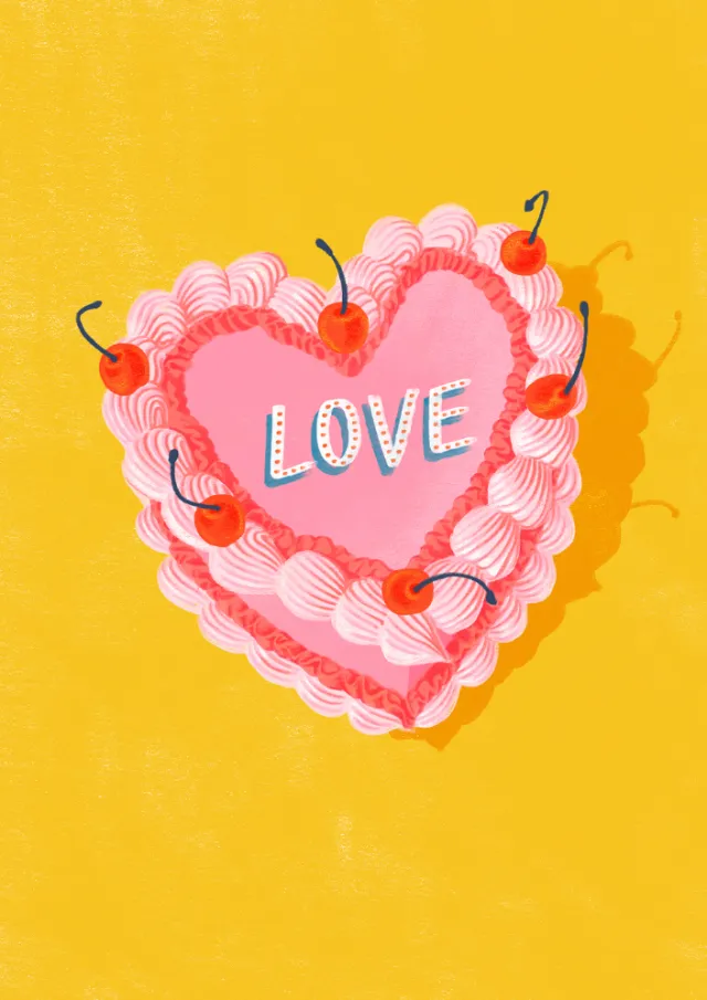 Heart-shaped pink cake with cherries spelling love