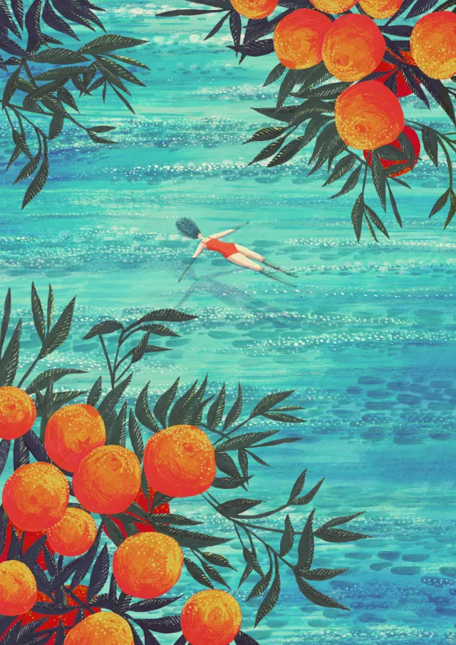 Swimmer in blue water with orange fruit trees around