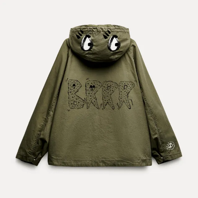 Green jacket with eyes on hood and Brrr text on back