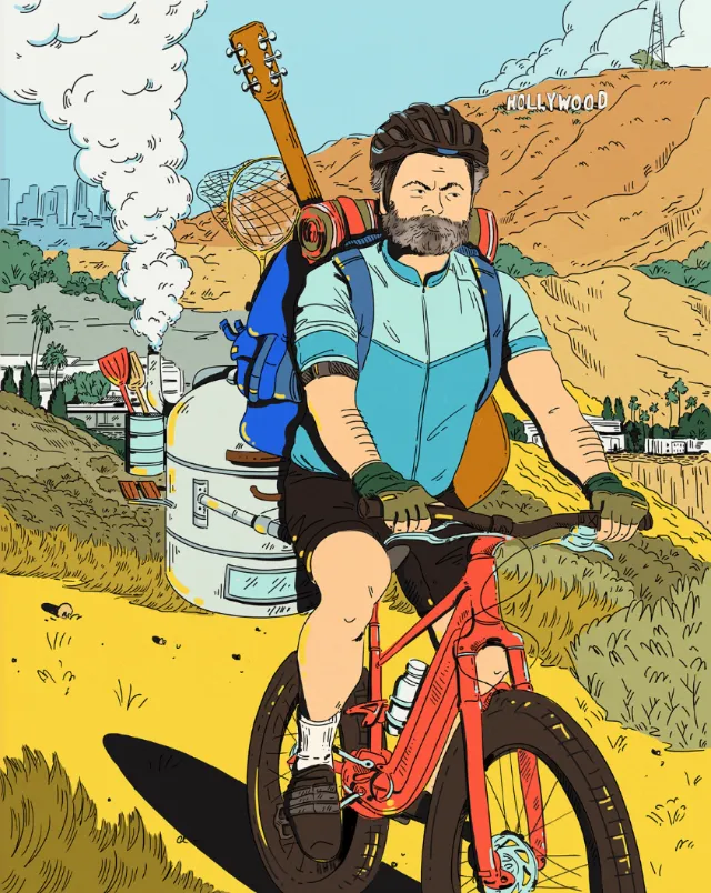 Cyclist with backpack and guitar biking near Hollywood sign and city