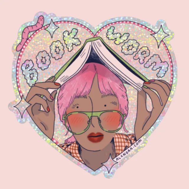Person with pink hair and glasses reading book titled Book Worm