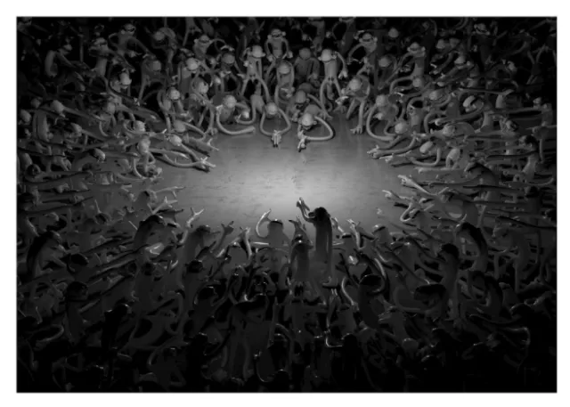 Crowd of people reaching inward in a circular formation in grayscale.