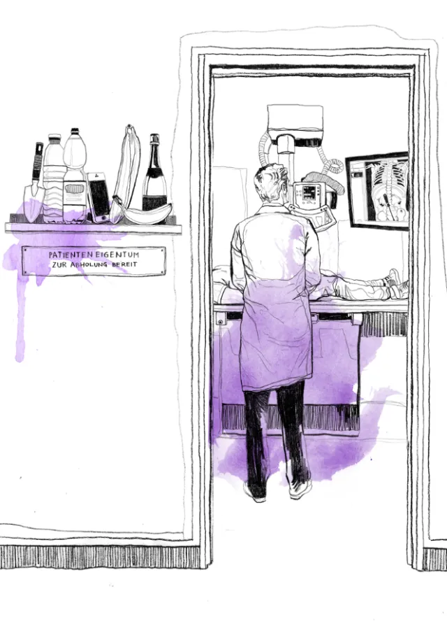 Person working in a lab or kitchen seen through doorway with bottles on shelf