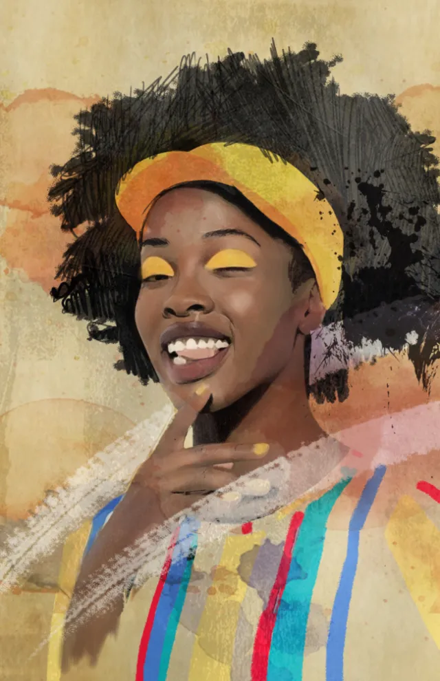 Smiling woman with afro hair and yellow eyeshadow wearing a colorful outfit