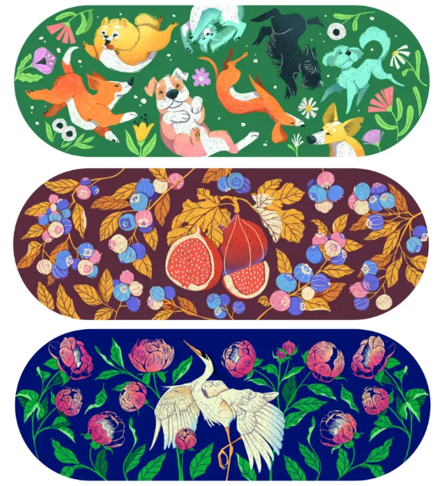 Three skateboard decks with dogs, fruit, and cranes artwork