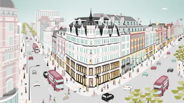 City street scene with historic buildings, red buses, and pedestrians.