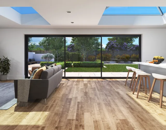 Modern living room with large bi-fold sliding doors opening to garden