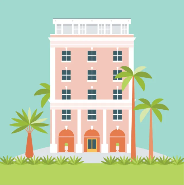 Pink hotel building with palm trees and grass under blue sky