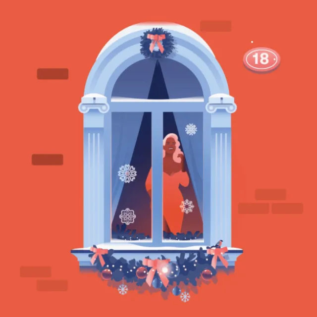 Woman in red dress looking out decorated holiday window