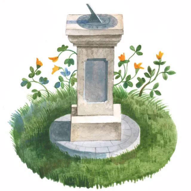 Stone sundial on grassy patch with yellow flowers and clovers