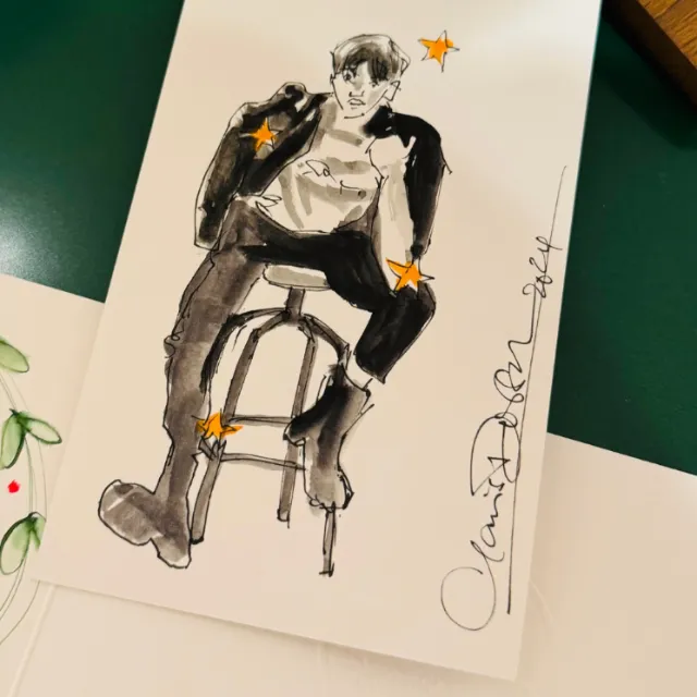 Sketch of a person sitting on a stool with orange stars