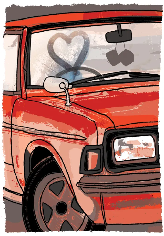 Red car with frosty windshield and heart drawn on glass