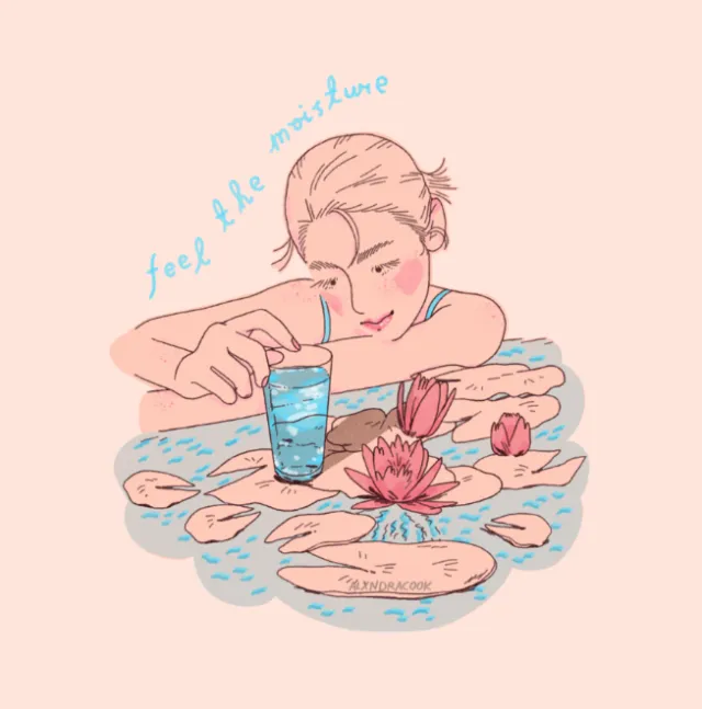 Woman leaning on water surrounded by lotus flowers and a glass of water