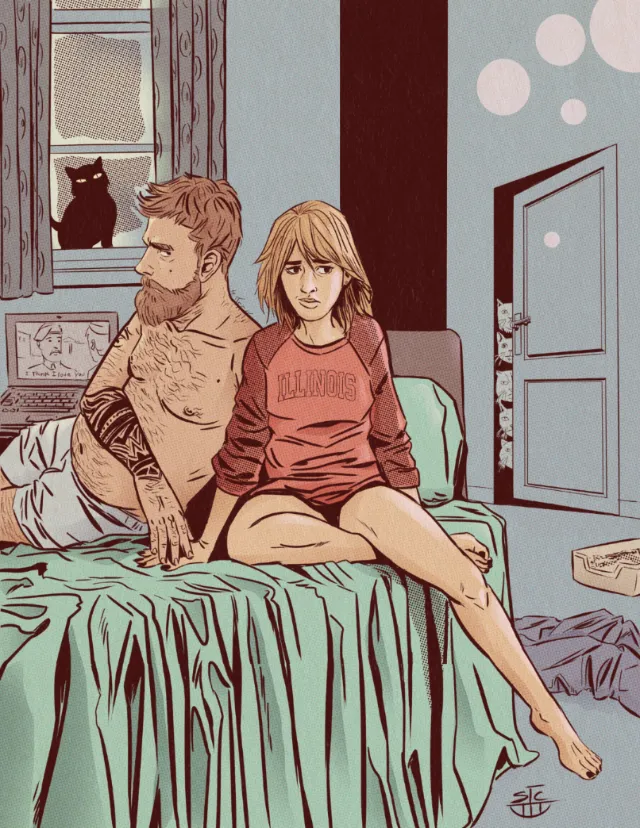 Man and woman sitting on bed with cat on windowsill nearby