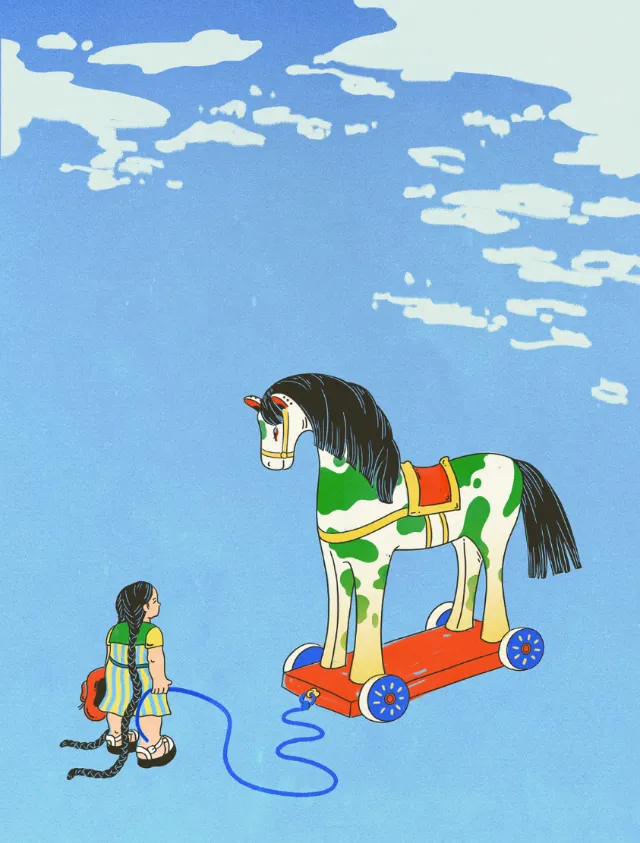 Child holding a rope attached to a wooden horse toy on wheels