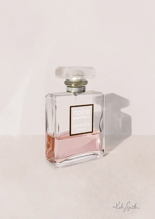 Coco Mademoiselle perfume bottle with pink liquid on light surface