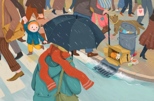 Person holding umbrella and scarf walking in busy street with people