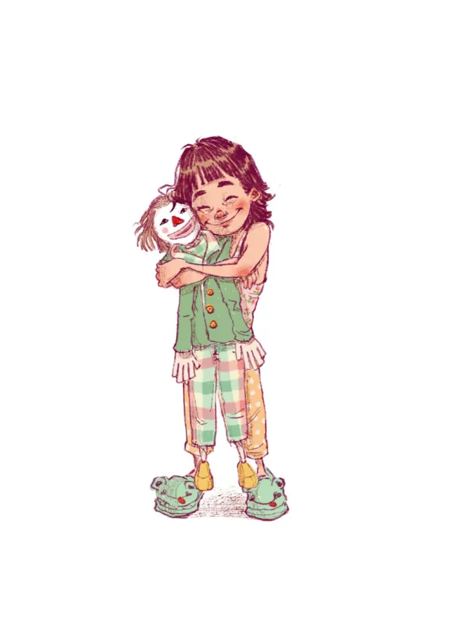 Happy girl hugging scarecrow doll in colorful patchwork clothing