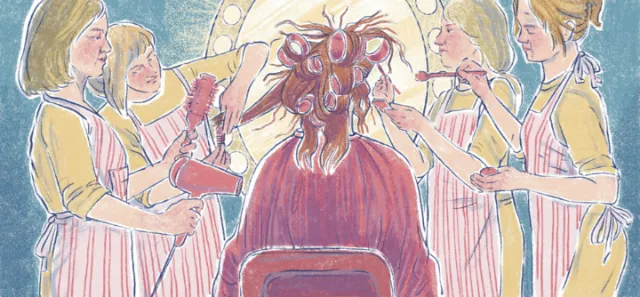 Group of women styling hair of a seated person in a salon
