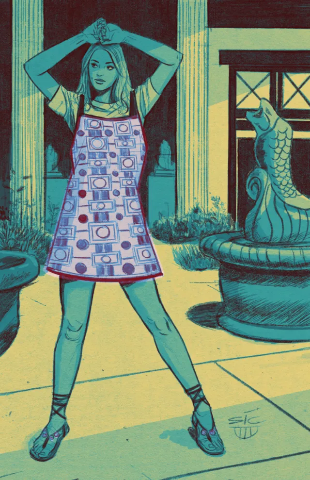 Woman wearing patterned smock in outdoor courtyard with fountain