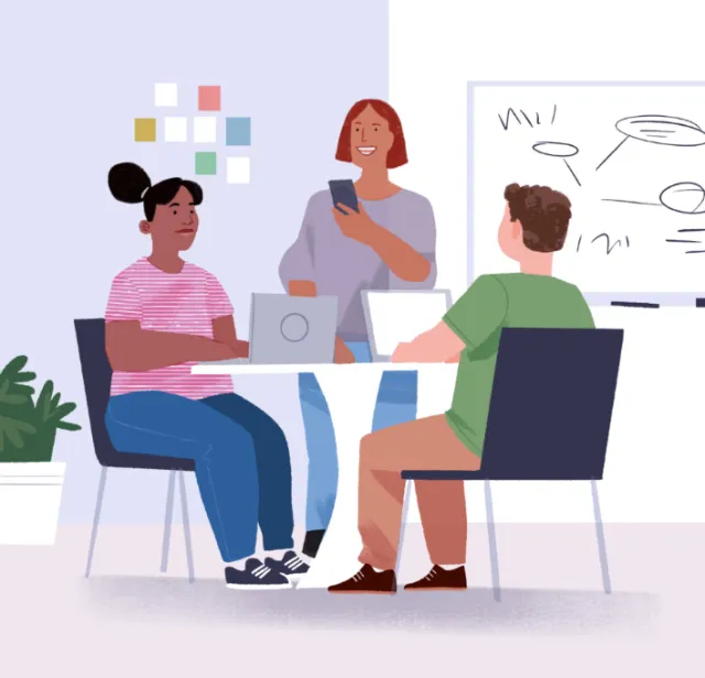 Three people collaborating in office meeting with laptops and whiteboard