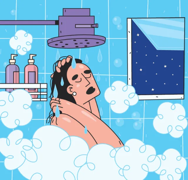Man washing hair under shower with night sky visible